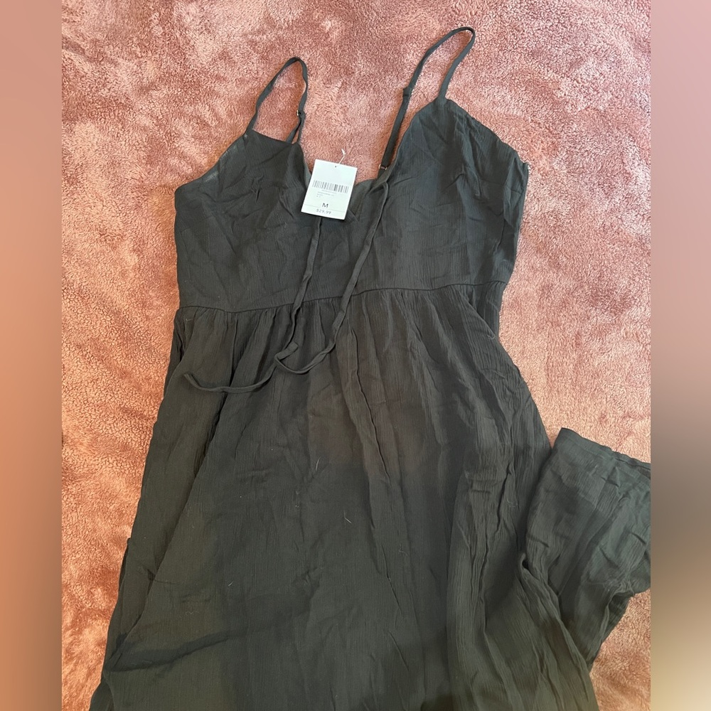 Long, black forver21 dress with spaghetti straps. Size M. Tags on.